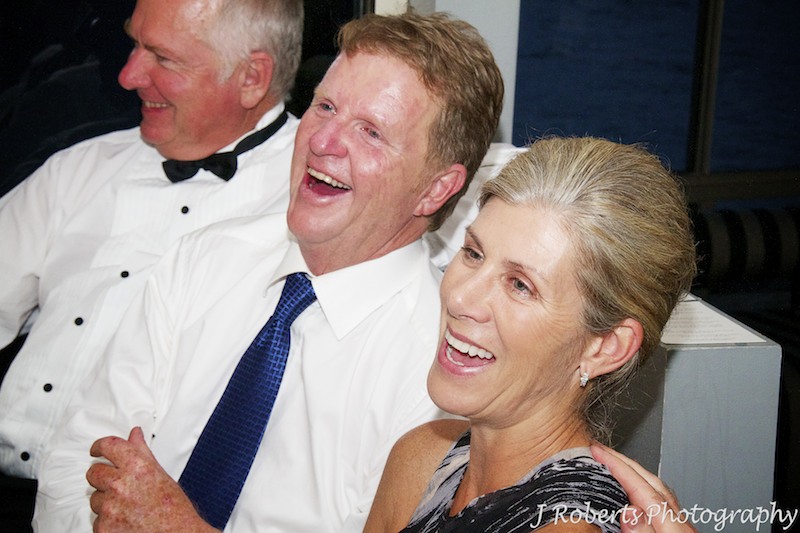 Brides parents laughing at wedding speeches - wedding photography sydney